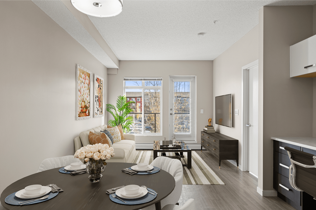 an open living room and dining room with a table and chairs