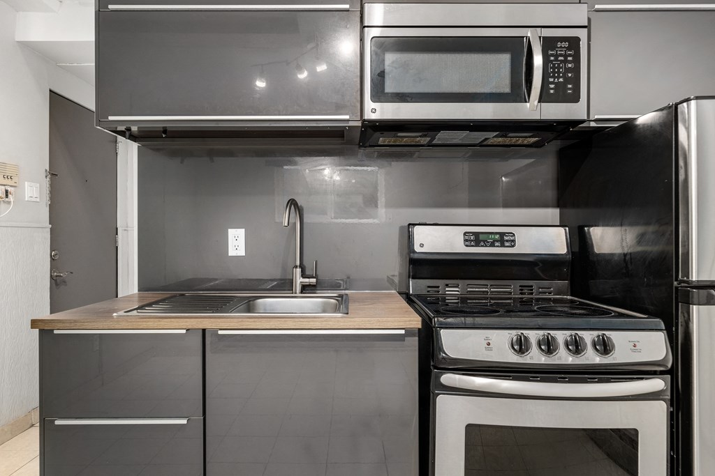 a kitchen with stainless steel appliances and a sink