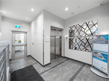 A hallway with a sign that says