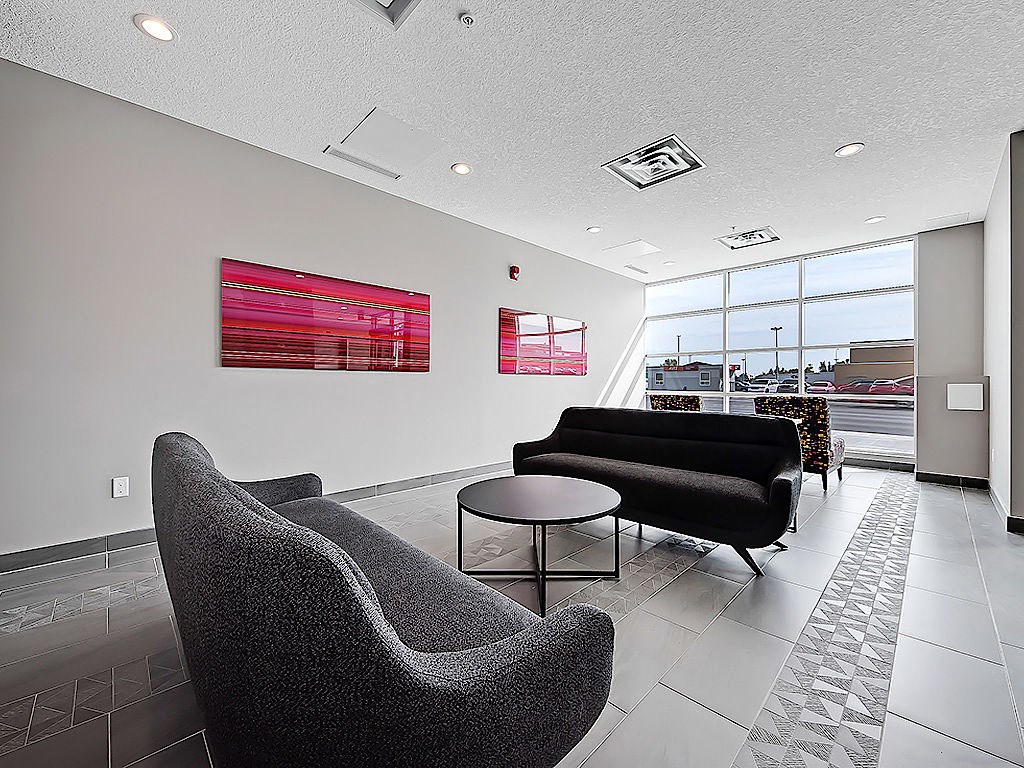 A modern waiting room with a view of the city.