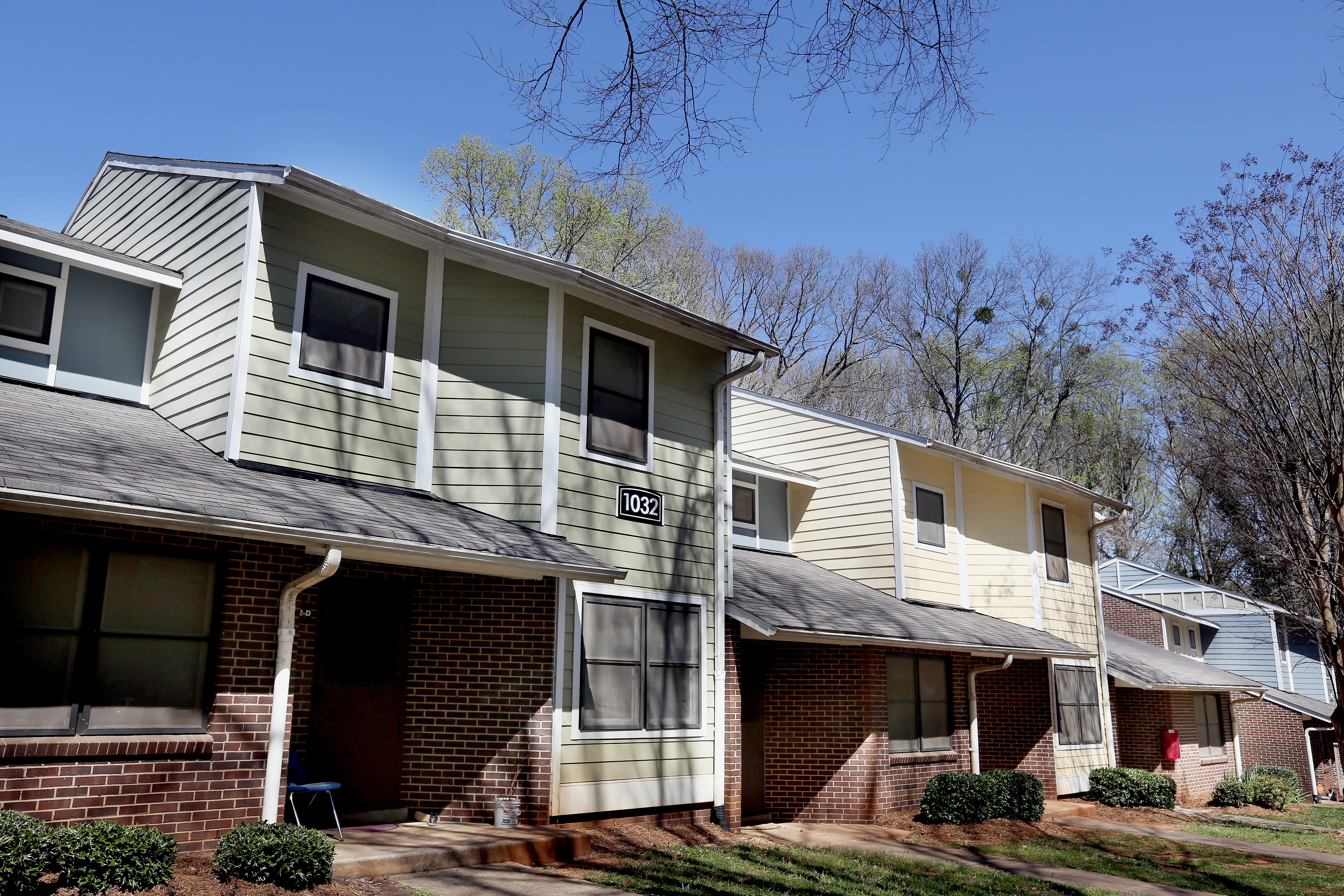 Apartment building with a clear blue sky in the background.