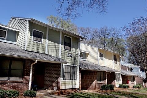 Apartment building with a clear blue sky in the background.