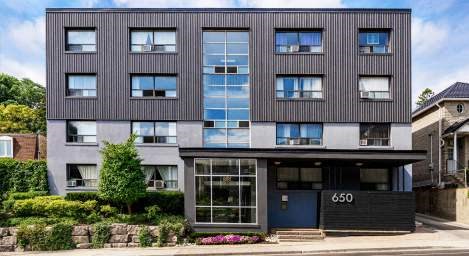 A modern building with the number 650 on the front door.