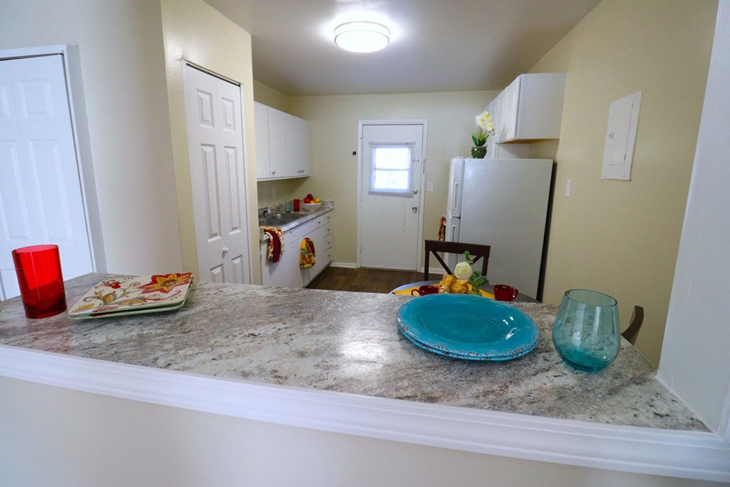 a view of the kitchen and dining area from the living room