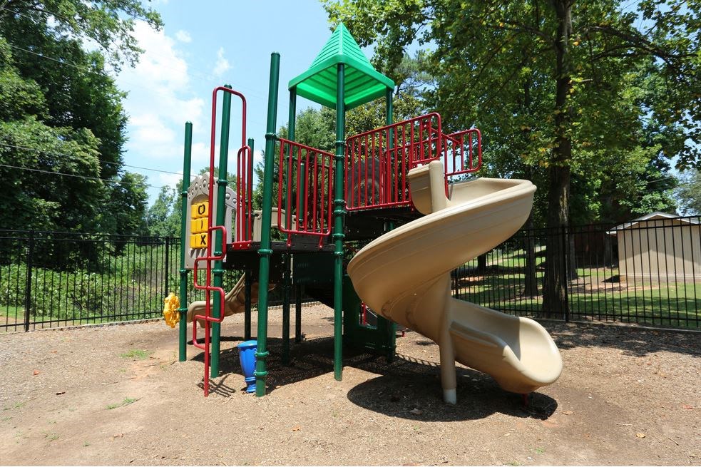 a slide at a playground in a park