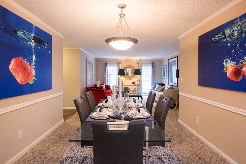 an image of a dining room with a table and chairs