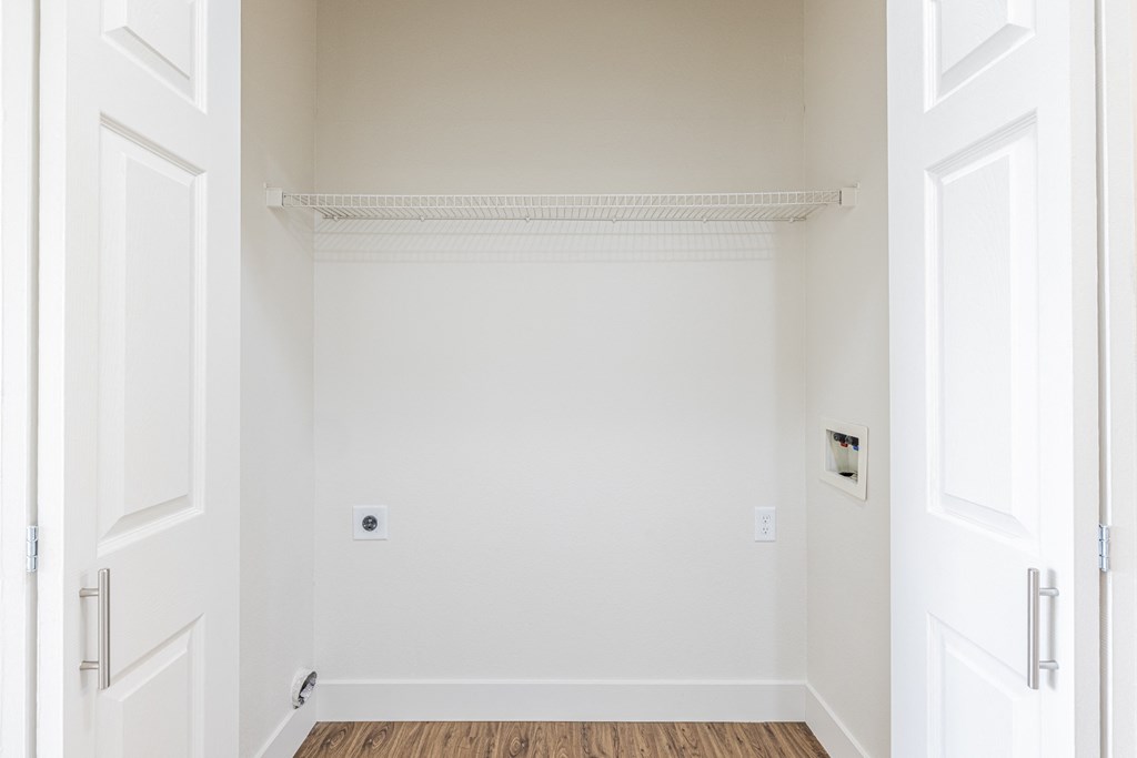 A designated space with washer and dryer hook ups for a washer and dryer