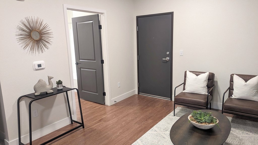 a living room with two couches and a table