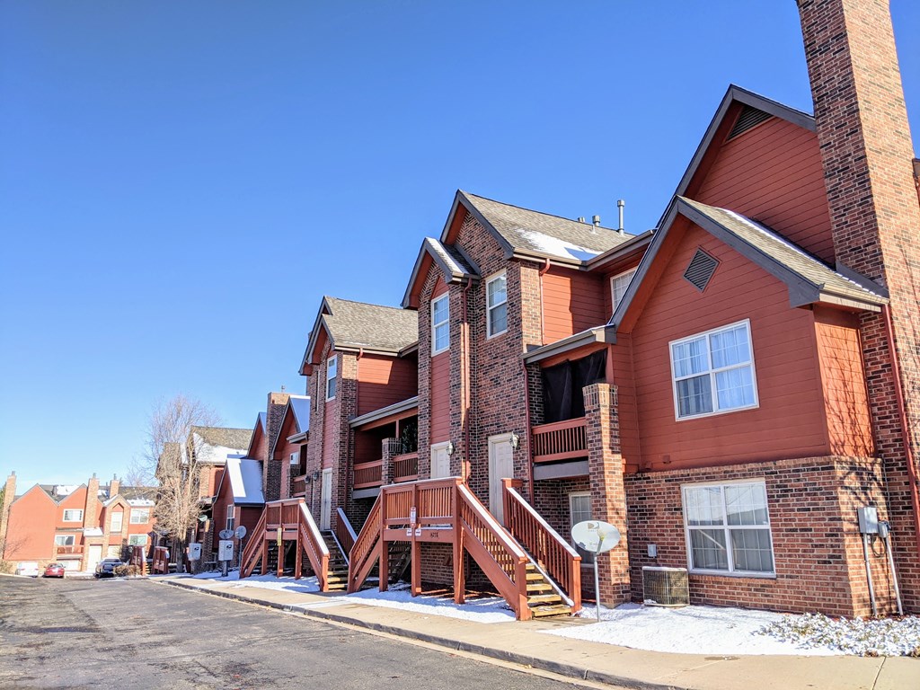 An apartment building that is painted orange