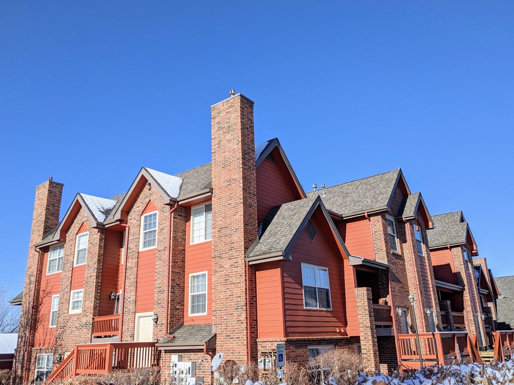 An apartment building that is painted orange