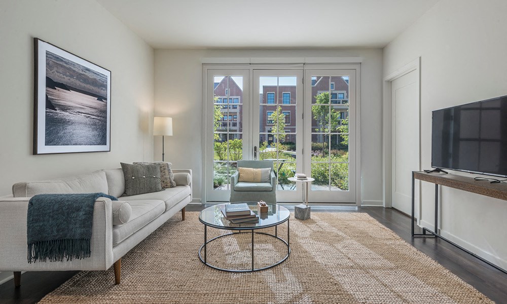 furnished living room with access to a private patio