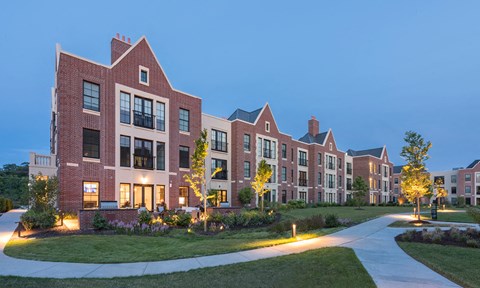 Kelmscott Park Apartment Homes with lights at dusk