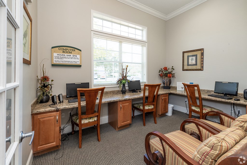 A sign on the wall of a room states that the computer is for "BANKING ONLY".