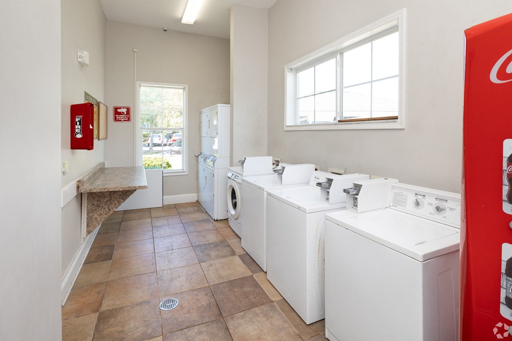 A laundry room with a washer and dryer in it.