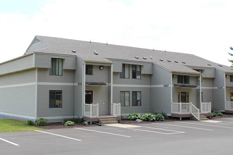 A grey building with the numbers 1035 and 1037 on it.