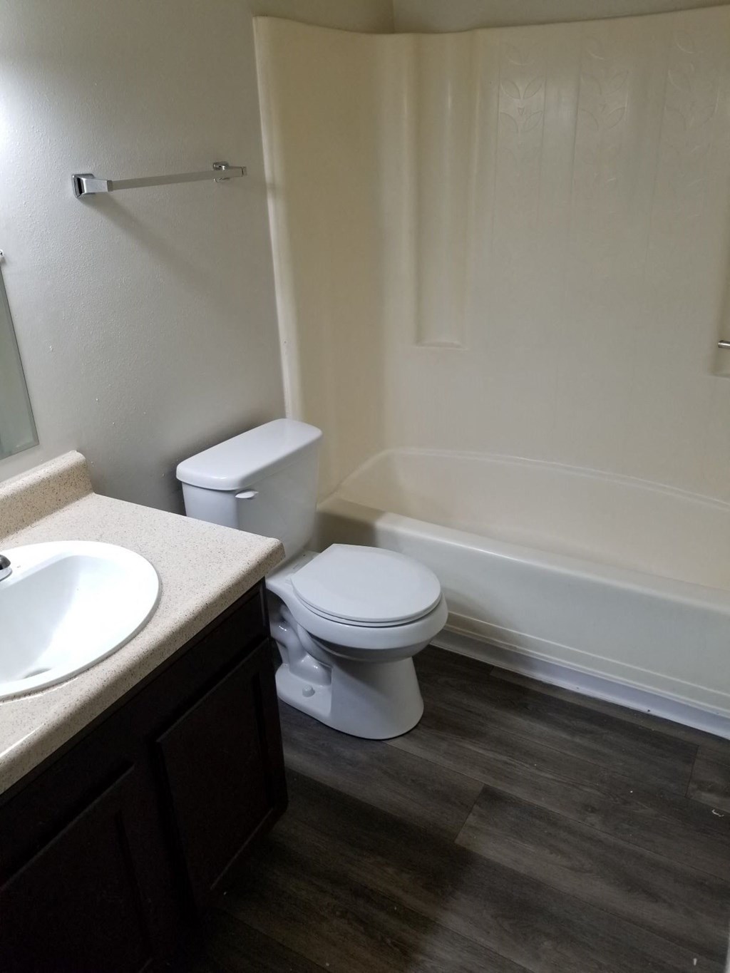 a bathroom with a toilet and a sink and a bath tub