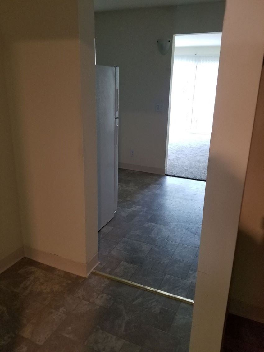 a view of the living room from the kitchen with the door open