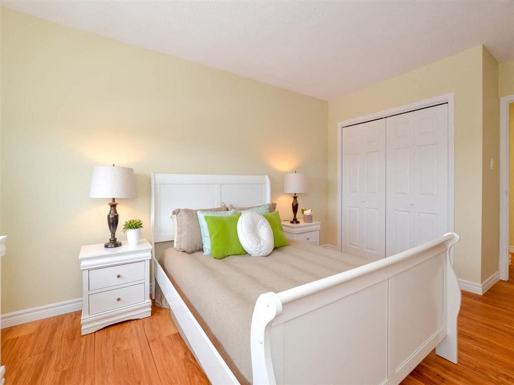 a bedroom with a bed and a closet