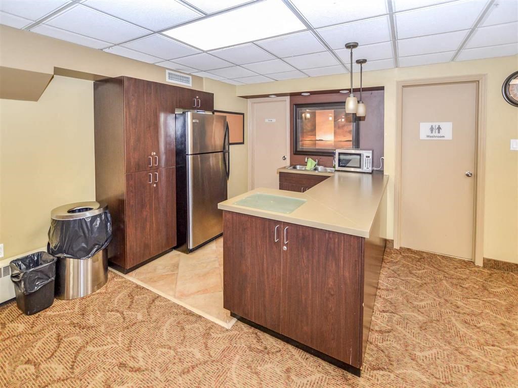 a kitchen with a stainless steel refrigerator and a counter top