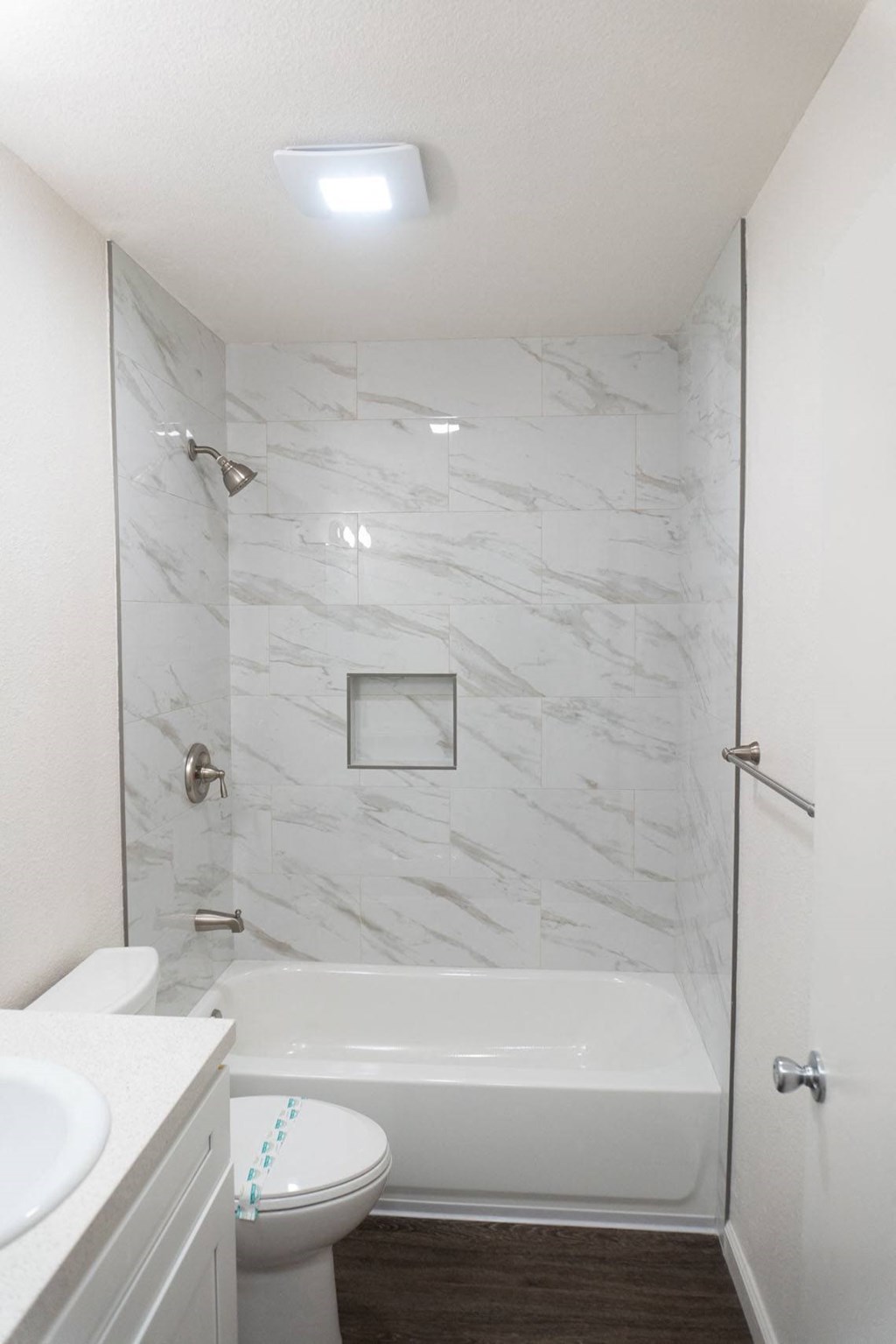 a bathroom with a shower and a toilet and a sink at Casa Sol Apartments, California