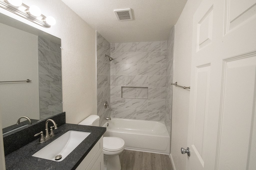 an image of a bathroom with a sink and a toilet at Sycamore Hills Village Apartments, California