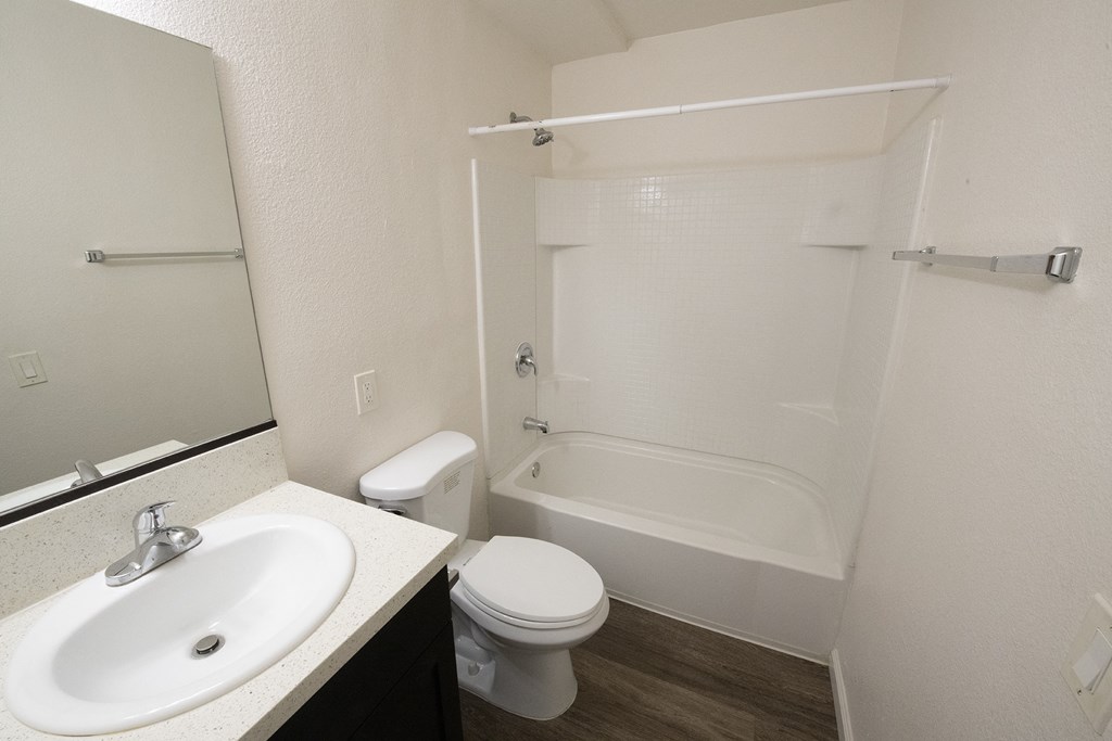 an empty bathroom with a sink toilet and shower at Villa Quixote Apartments, Escondido, CA