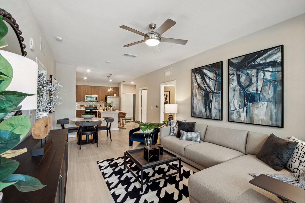 a living room and dining room with a couch and coffee table