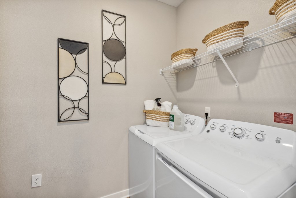 the washer and dryer in the laundry room of a house