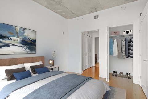 a bedroom with a bed and a closet