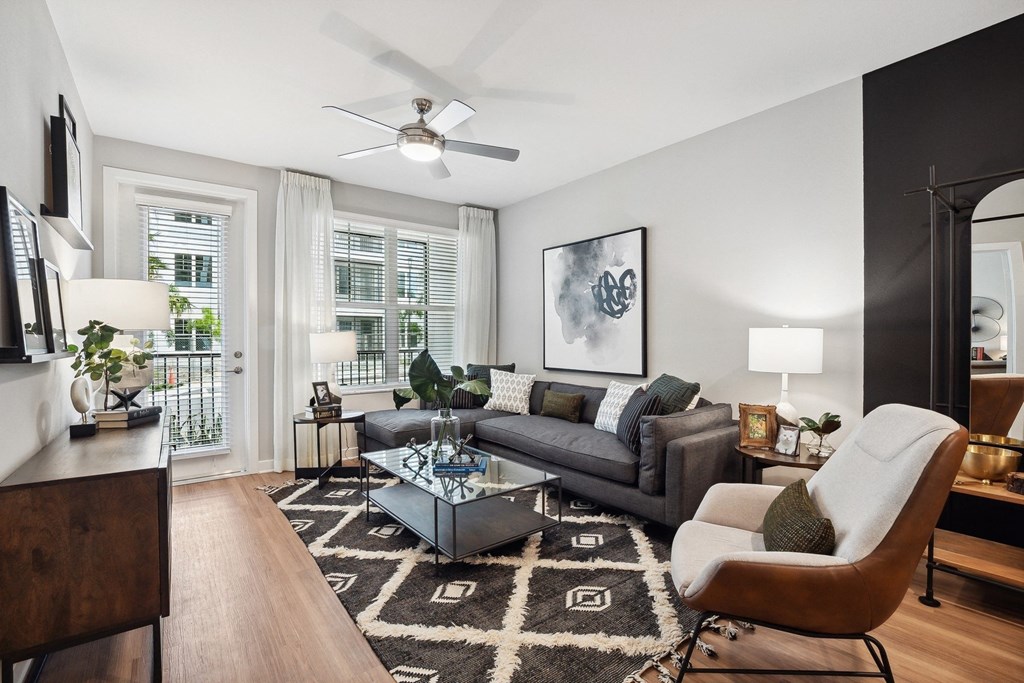 the living room of an apartment with a couch and a coffee table