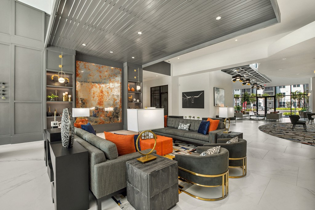 a living room filled with furniture and a large window