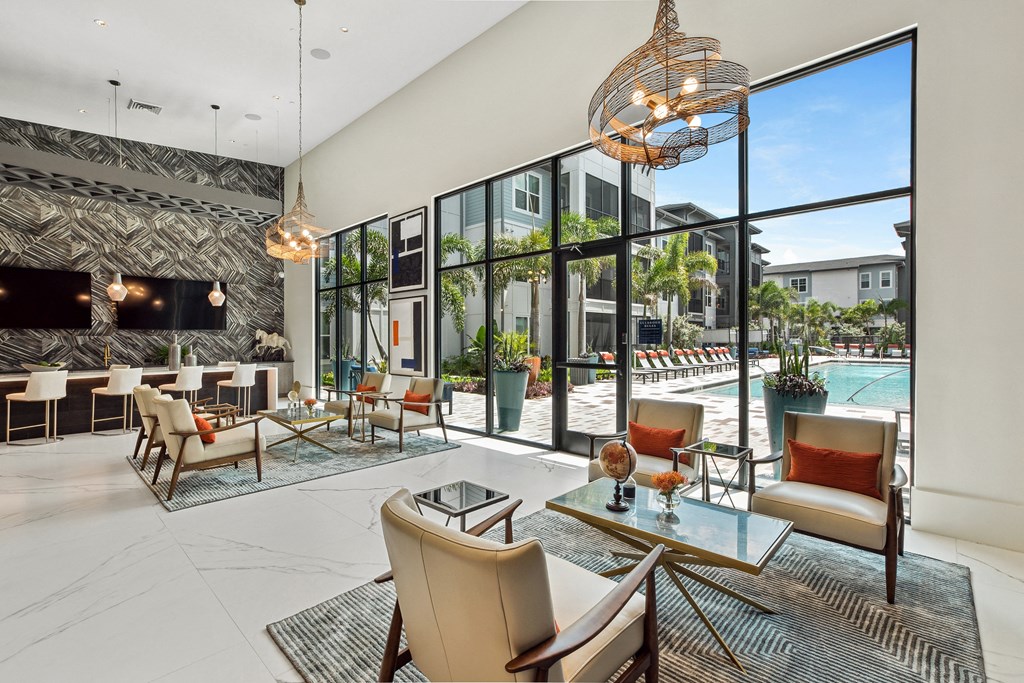 a living room filled with furniture and a large window
