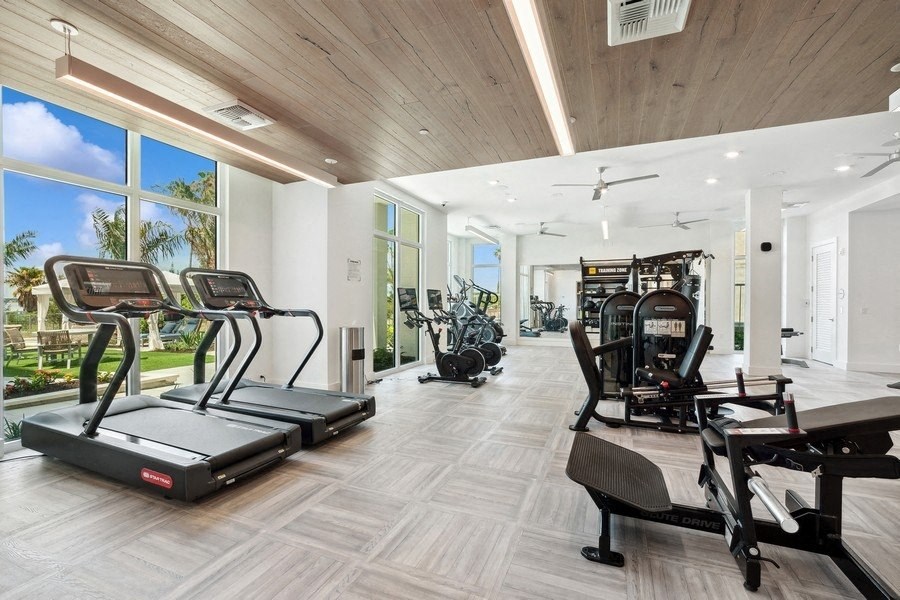 the mansion has a gym with a view of the ocean