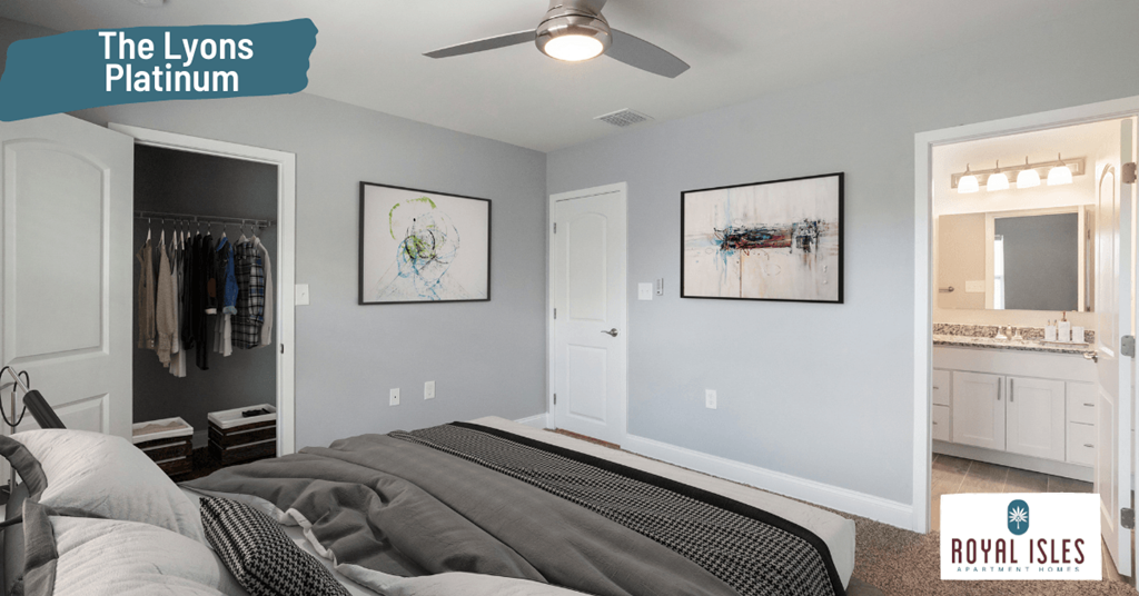 a bedroom with a bed and a closet and a ceiling fan