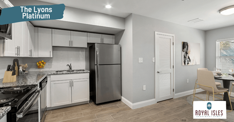 a kitchen with white cabinets and a stainless steel refrigerator