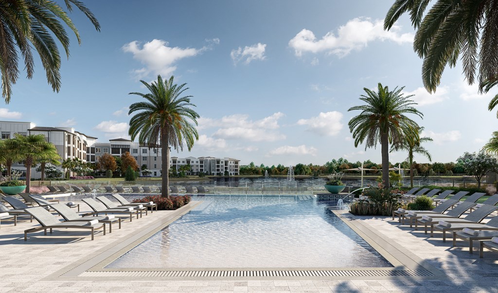 a large pool with chairs and palm trees at the resort