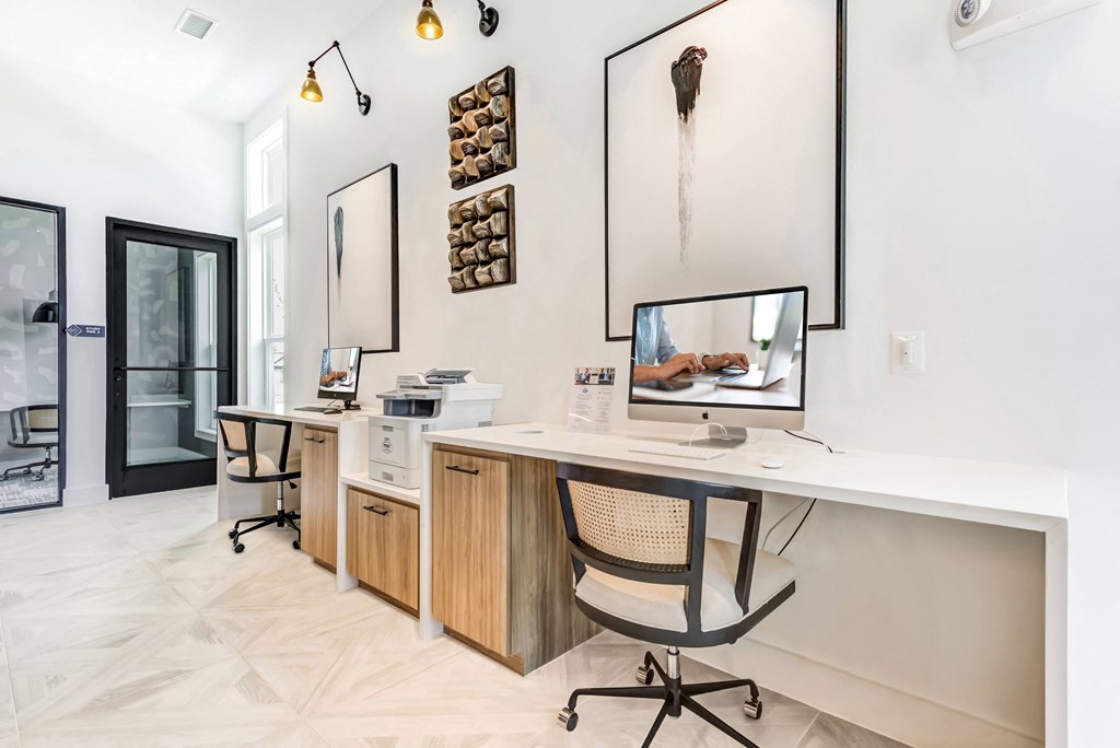 a home office with a desk and a computer on it