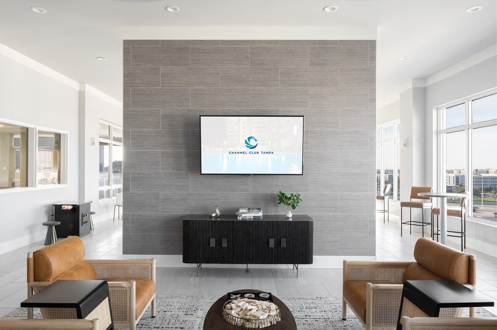 a living room with a tv on the wall