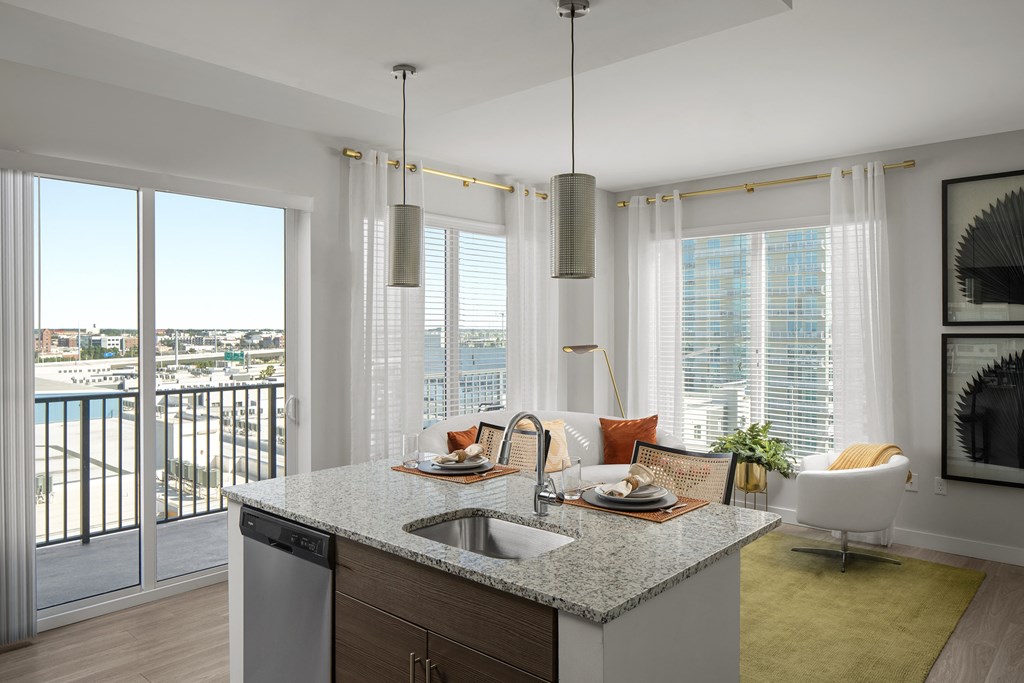 a kitchen and living room with a view of the city