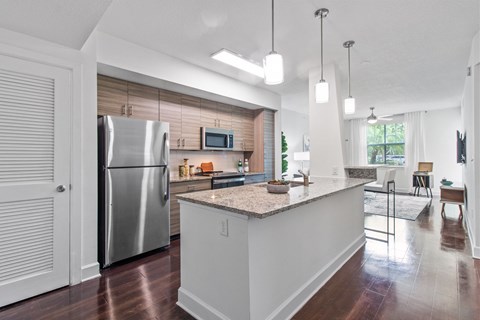 a kitchen with stainless steel appliances and a counter top