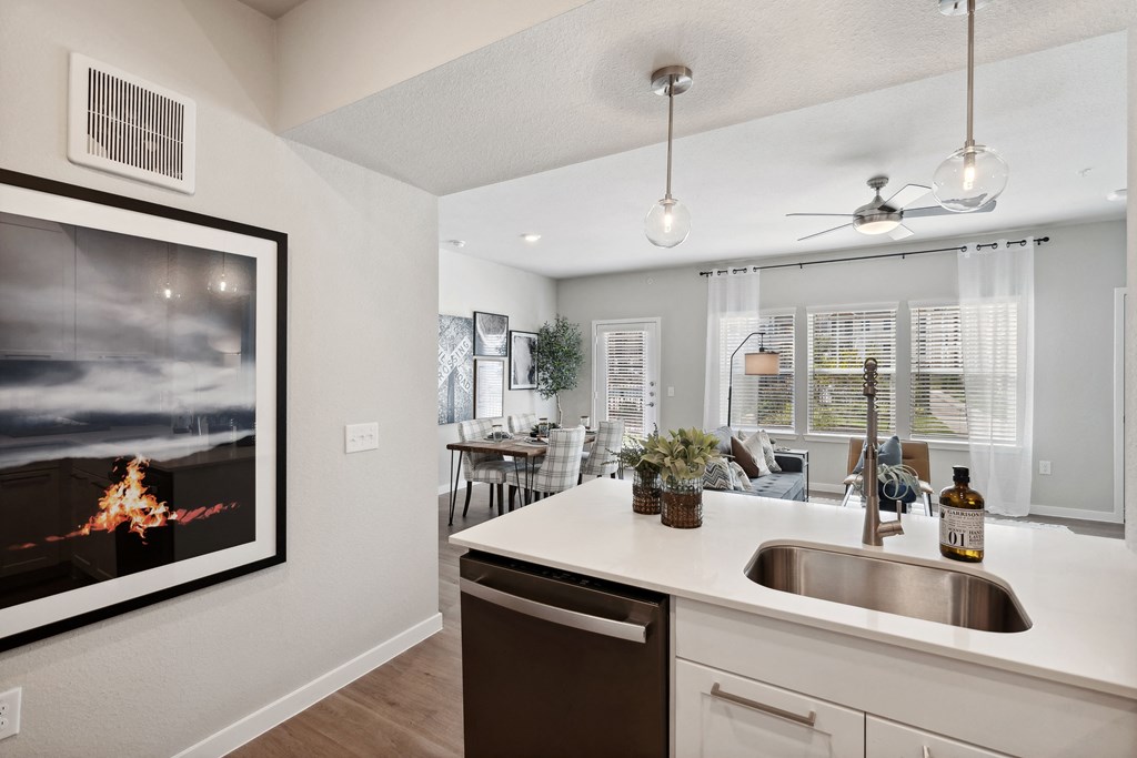the preserve at ballantyne commons apartment kitchen and living room with fireplace