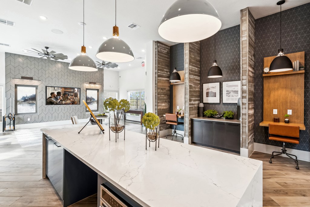 a large kitchen with a marble counter top
