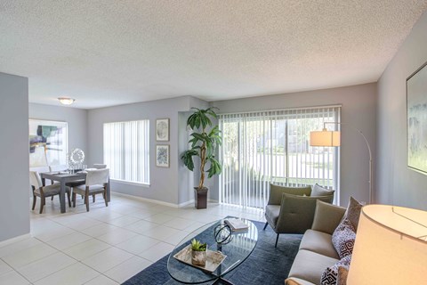 a living room with a couch and a glass table