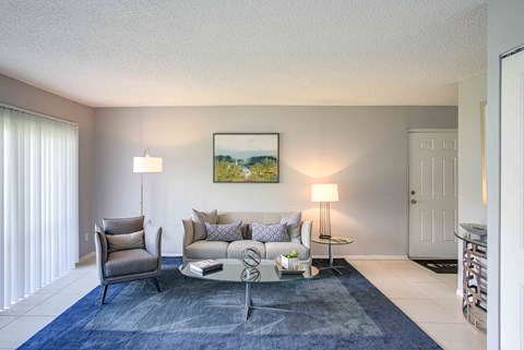 a living room with a couch and a table
