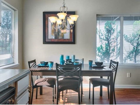 a dining room with a table and chairs