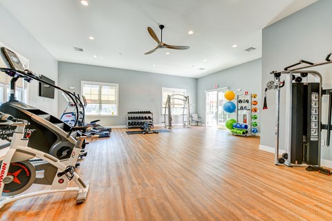 Bright fitness and yoga studio with wood floors at The Rail North Bergen