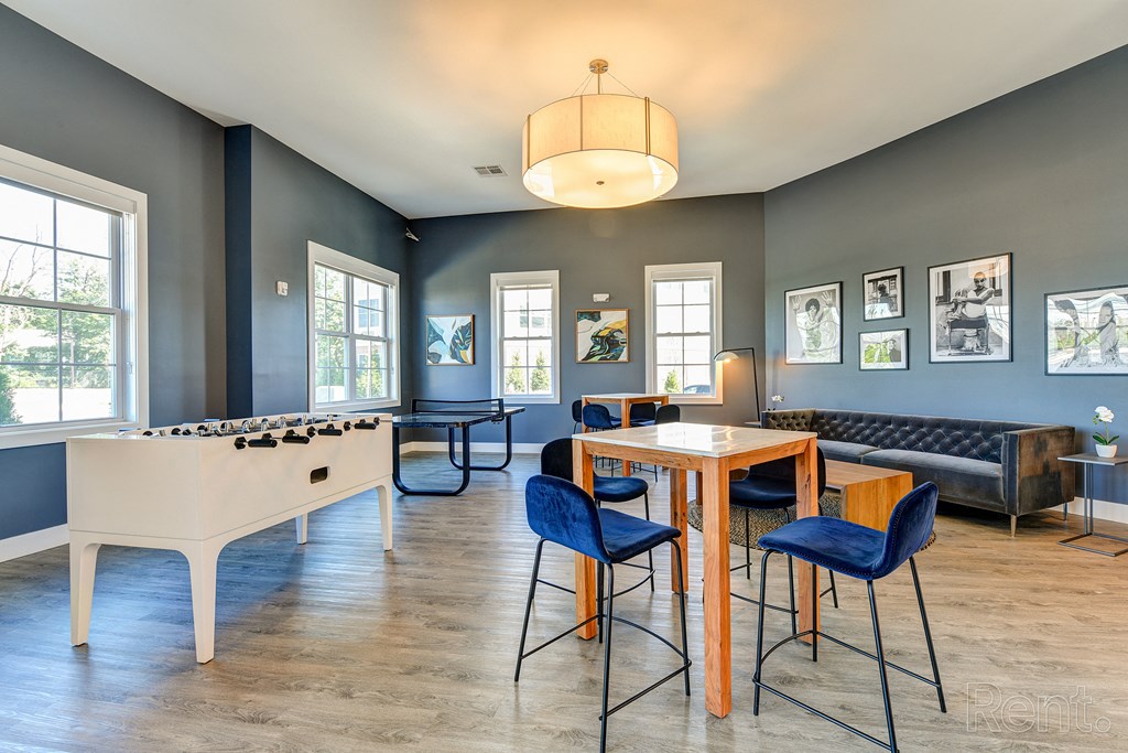 a game room with a table and chairs and a foosball at Solo at North Bergen, North Bergen, New Jersey
