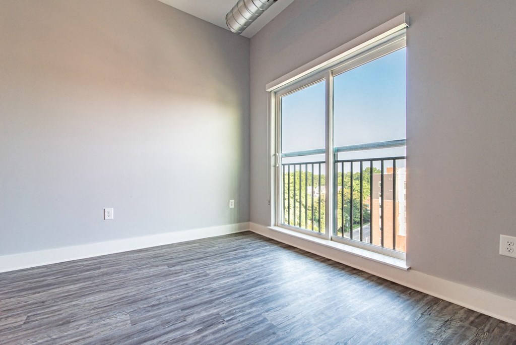 Living Area With Balcony at Novi Flats, Concord, North Carolina