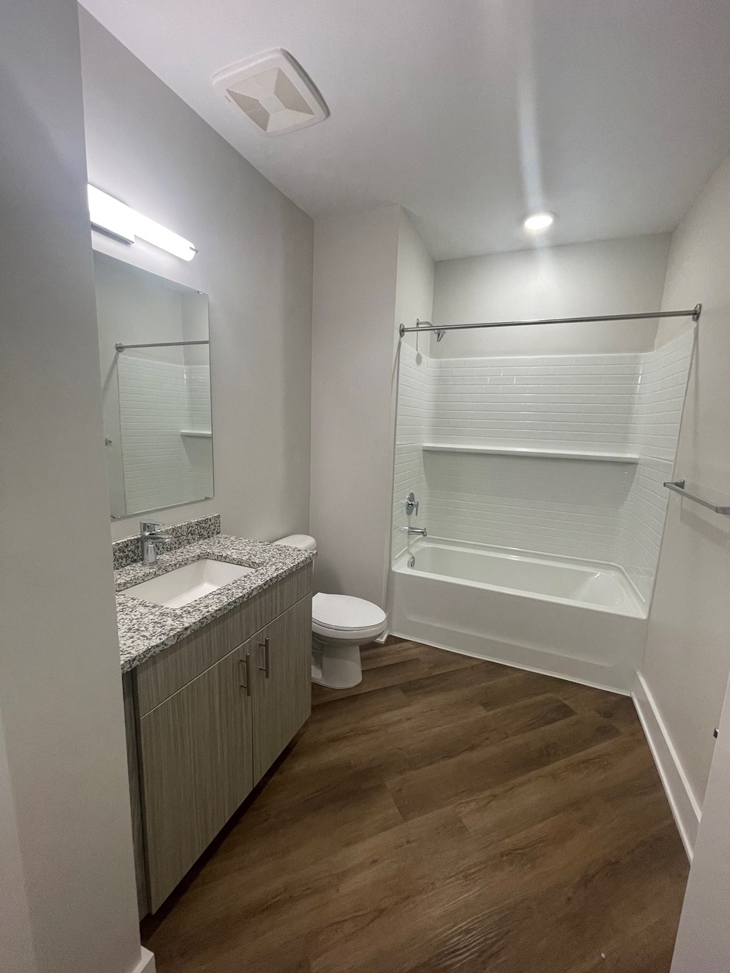 a bathroom with a shower sink and toilet and a mirror at Novi Rise, North Carolina