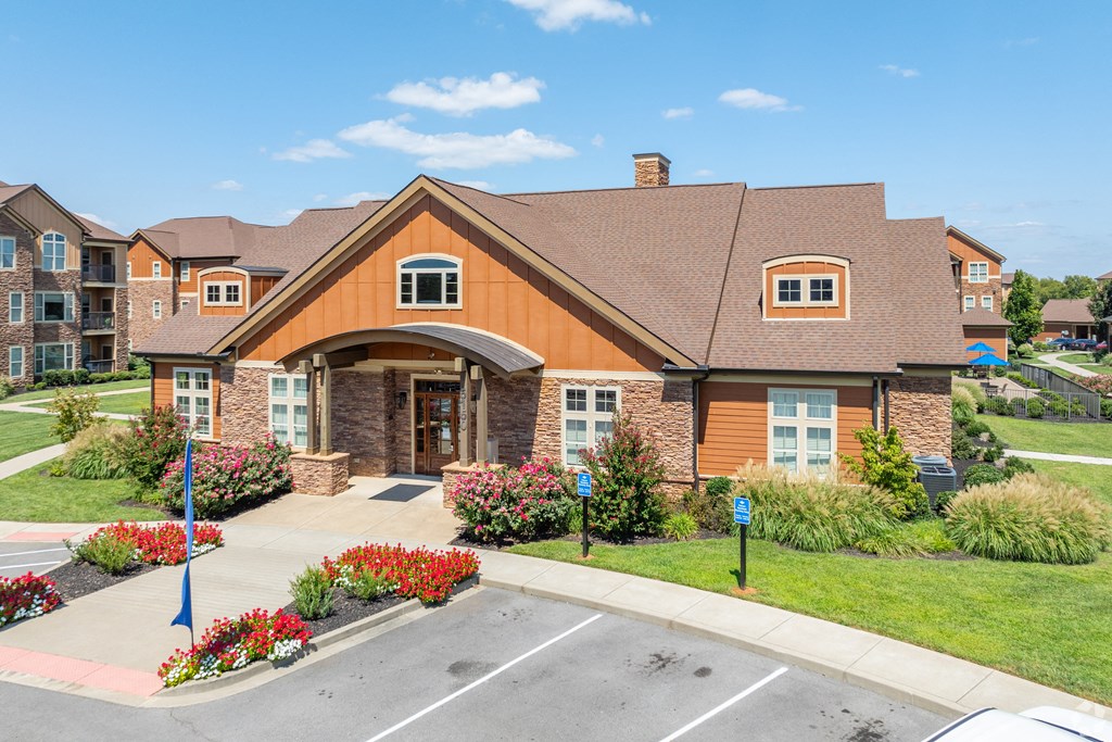 a house with a sidewalk in front of a parking lot